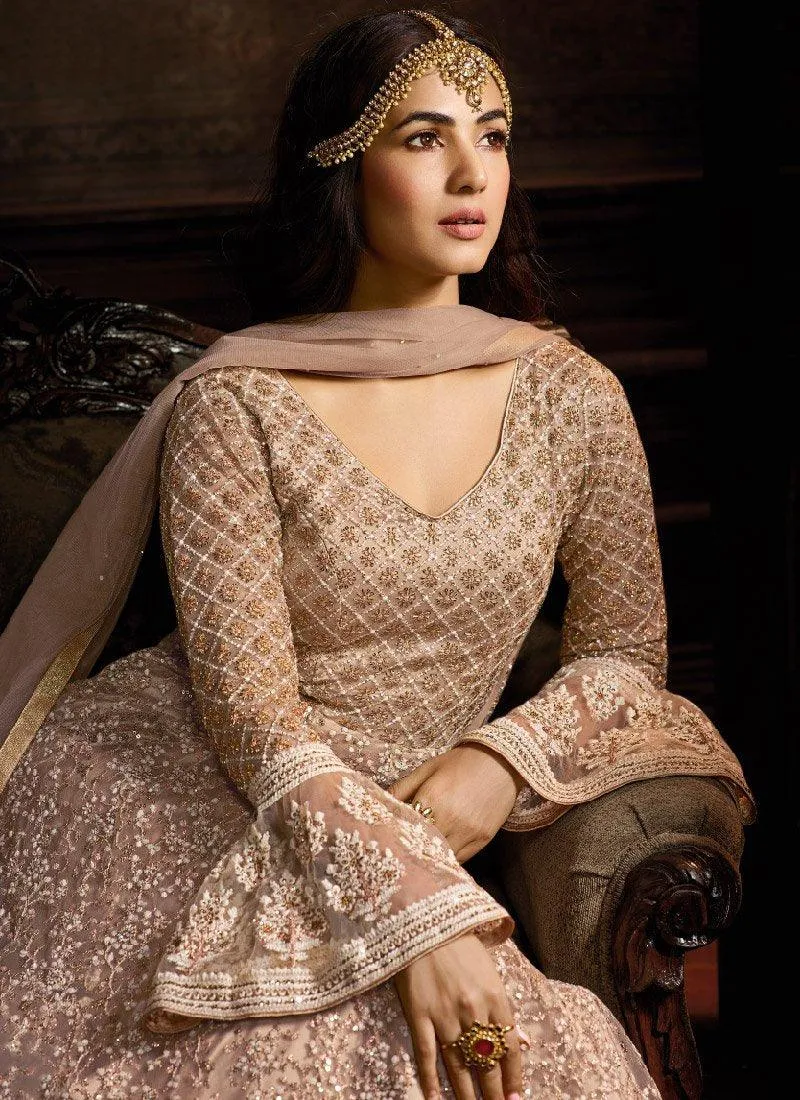 Alluring Peach Color Soft Net Base Embroidered Salwar Suit